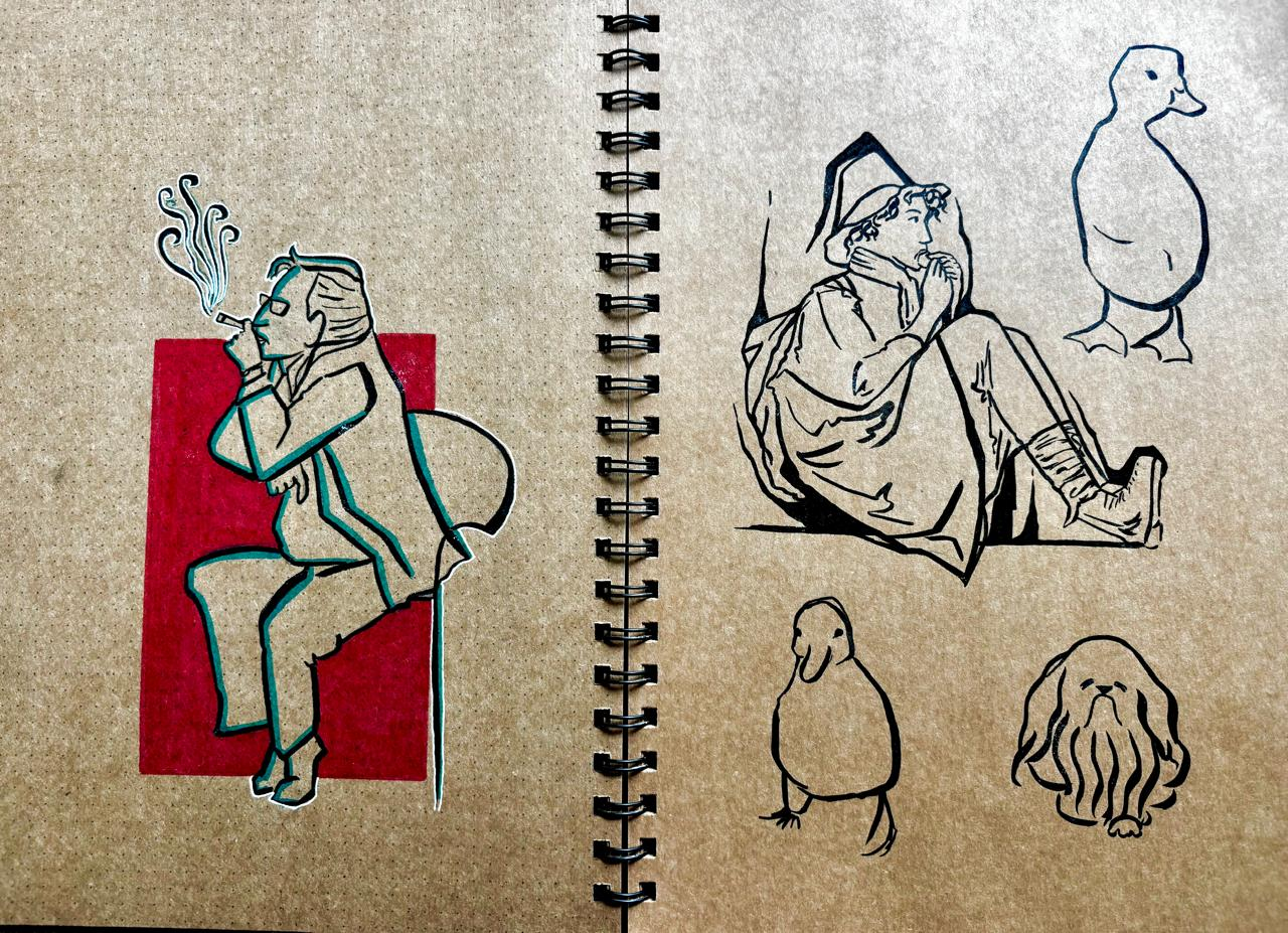 Sketchbook spread with character studies